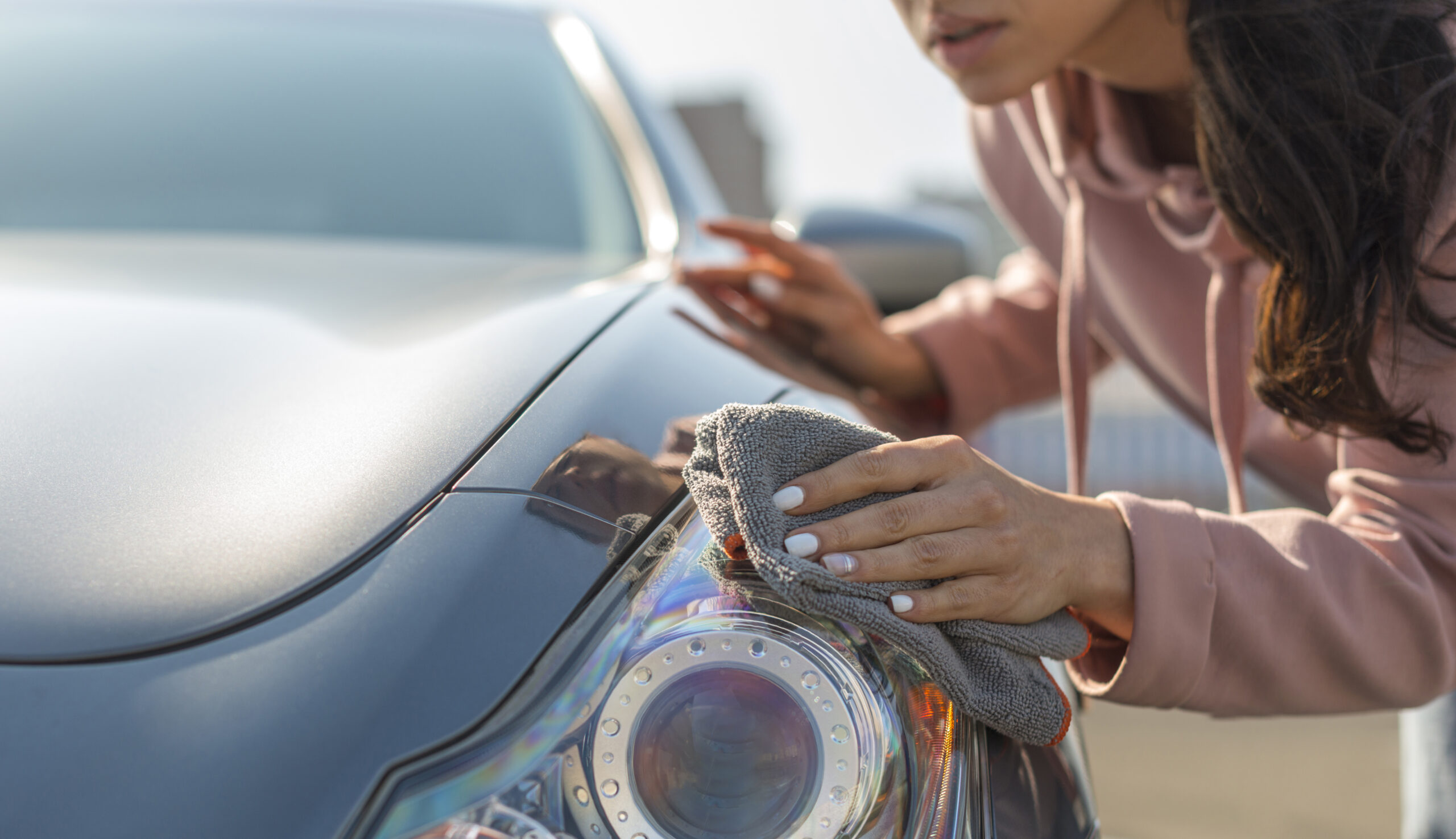 woman-taking-care-her-modern-car